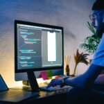 Young Man Mobile Developer Writes Program Code On 3FBNK5R Scaled 1 150x150