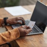 african american man paying online pzkeacg