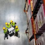 warehouse manager and workers consult plans betwee mwzjbnv.jpg